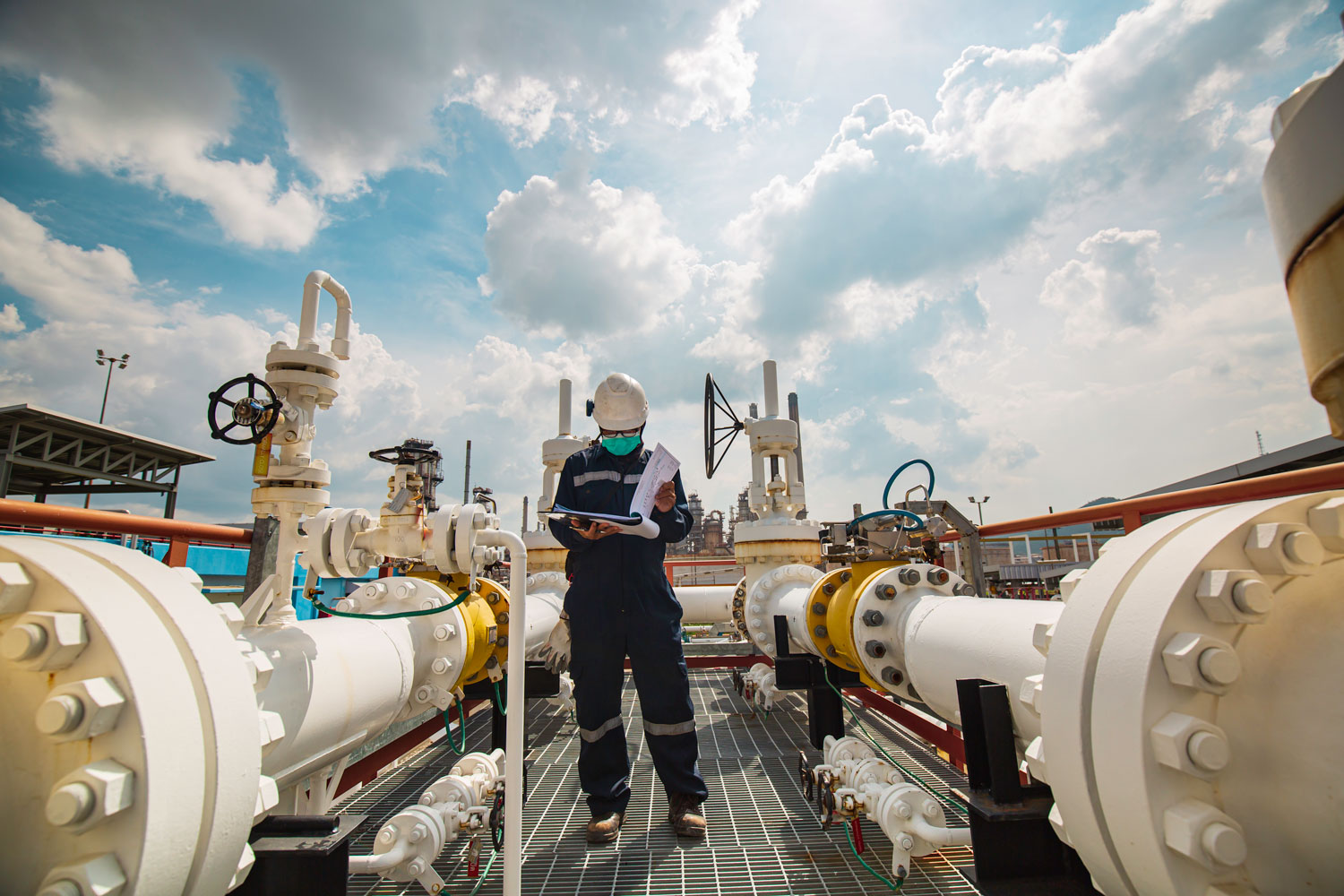 male-worker-inspection-steel-long-pipes-pipe-elbow-station-oil-factory-refinery-valve-visual-check-record-pipeline-oil-gas-industry